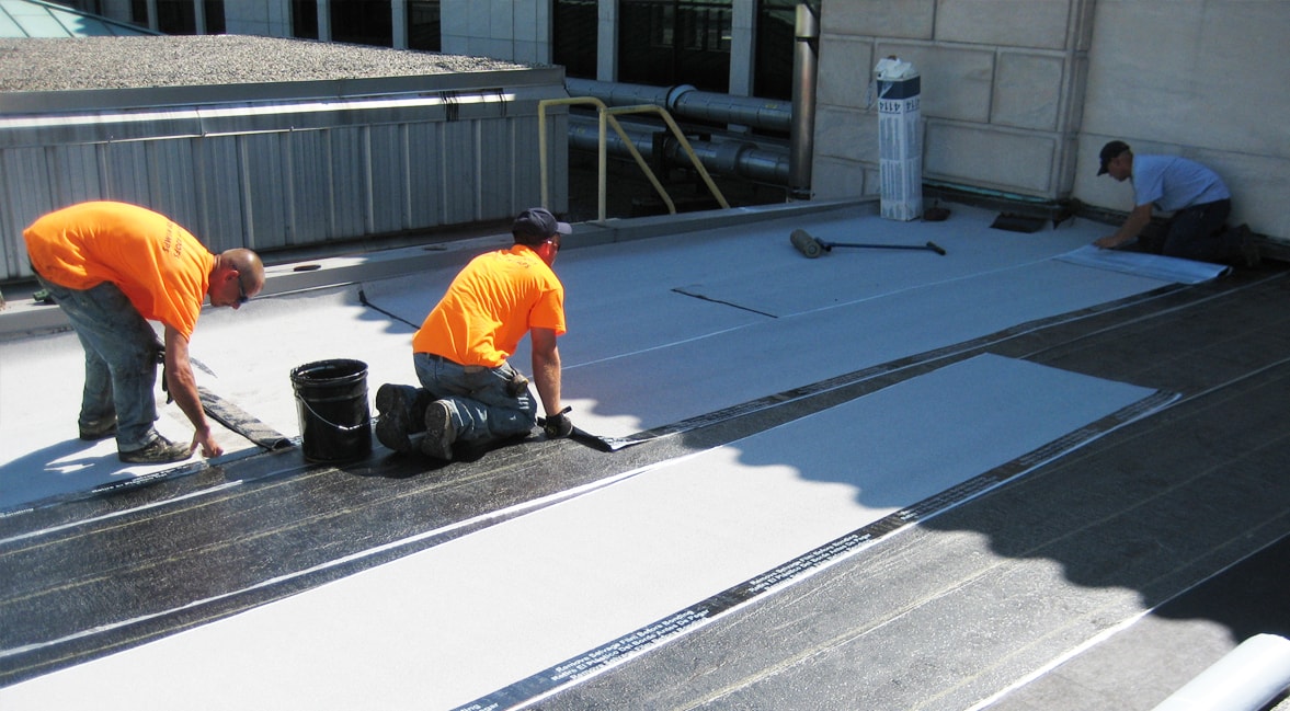 Expert roofing contractors installing a Modified Bitumen Roofing Material in Jacksonville, FL
