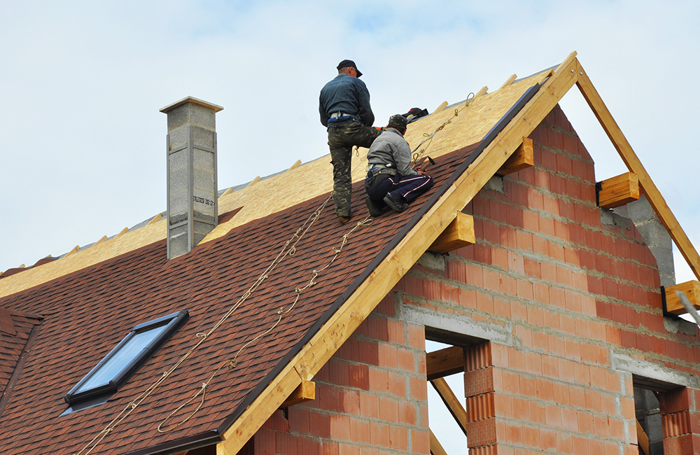 expert roofing contractors repairing a roof in Jacksonville, FL