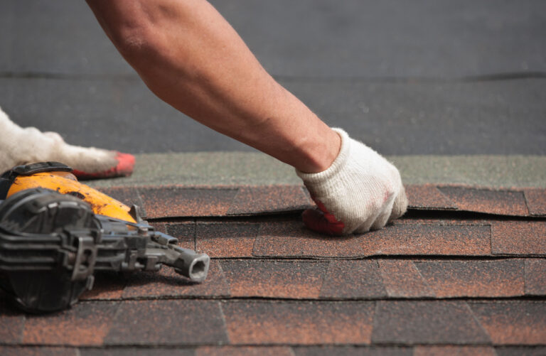 Roofers installing new roof